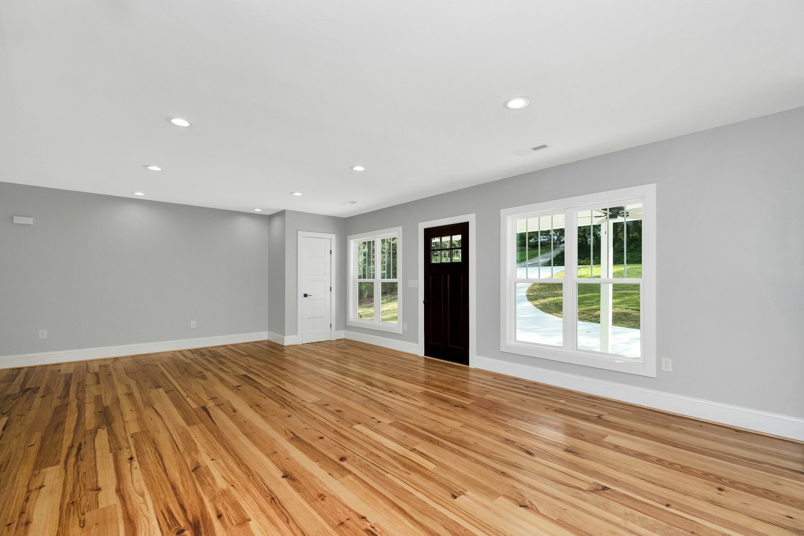 Empty room with new hardwood flooring